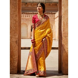 Sabyasachi-Inspired Tangerine Orange Silk Blend Saree & Red Designer Blouse Featuring Gold Zari Accents, Elegant Indian Wedding And Festive Sari In The India